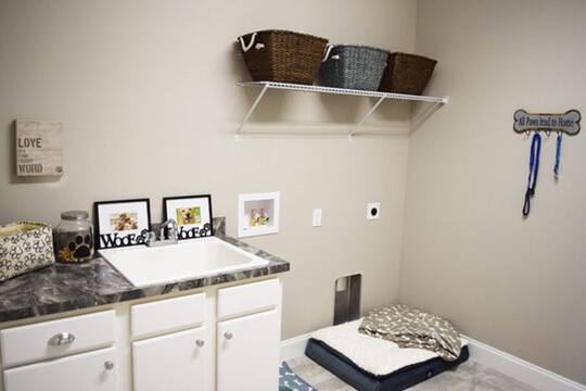 Laundry room in new Freedom Model by Triple Crown Homes