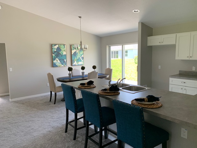 Kitchen peninsula and adjoining dining room